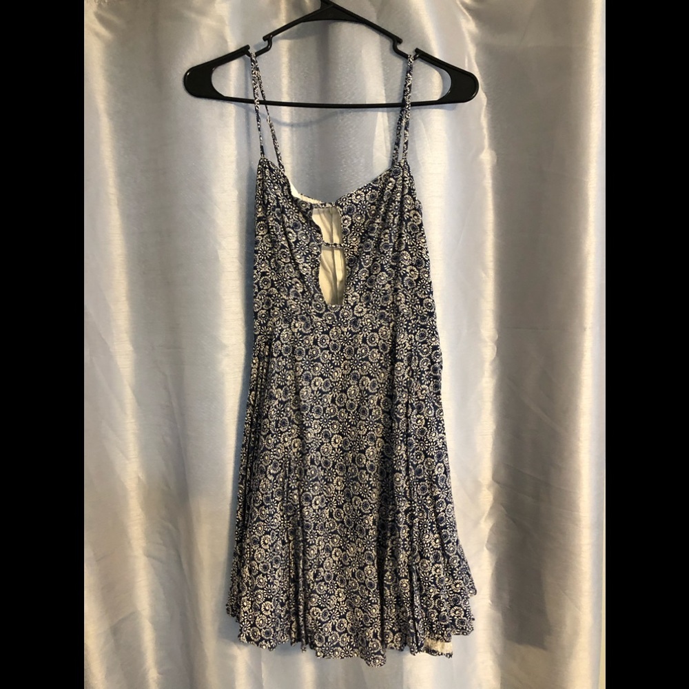 Blue and cream patterned flowy dress with cutout